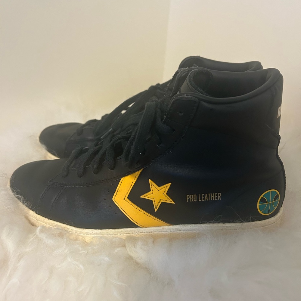 Converse Woman’s Black and Yellow High-Top Sneakers